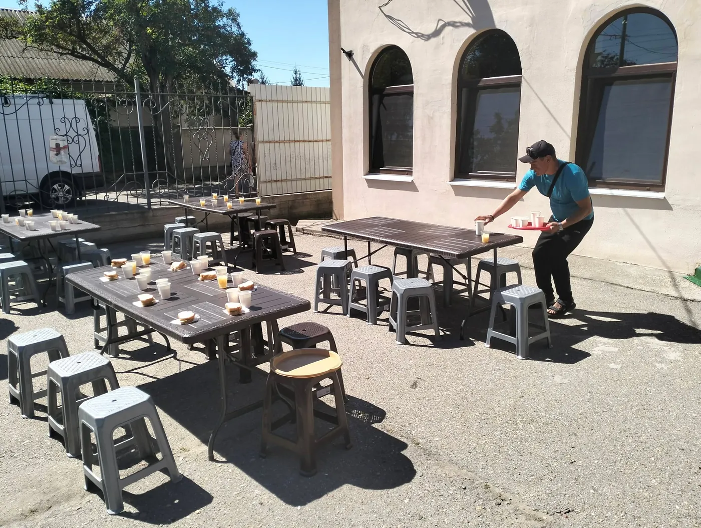 Outdoor tables prepared for serving a meal