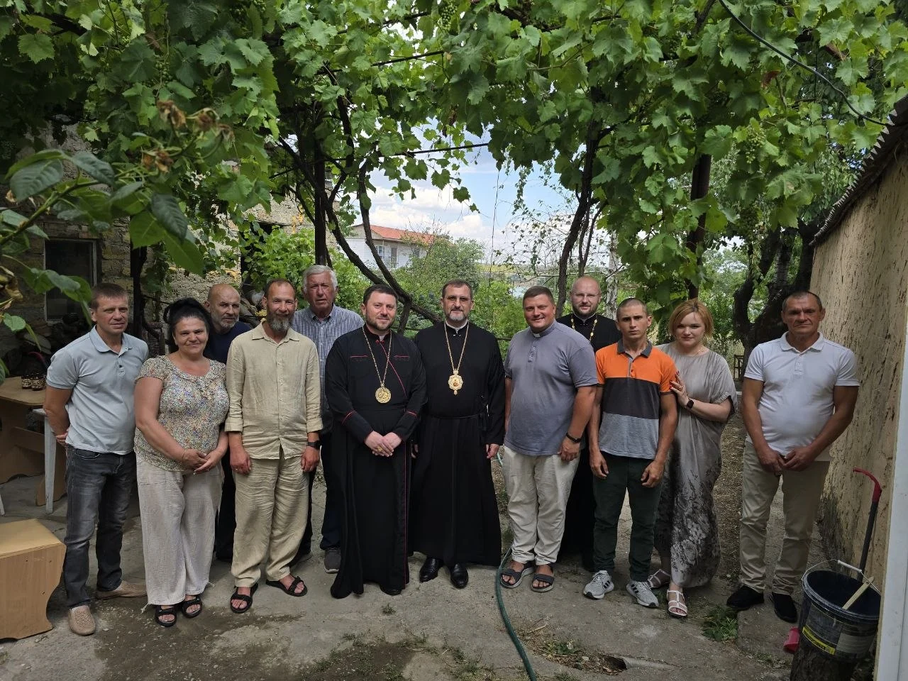 Guests and clergy together outdoors at the rehabilitation centre